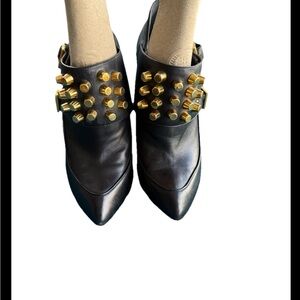 Gucci
Black Leather Gucci Ankle Boot with Gold Studded over boot strap